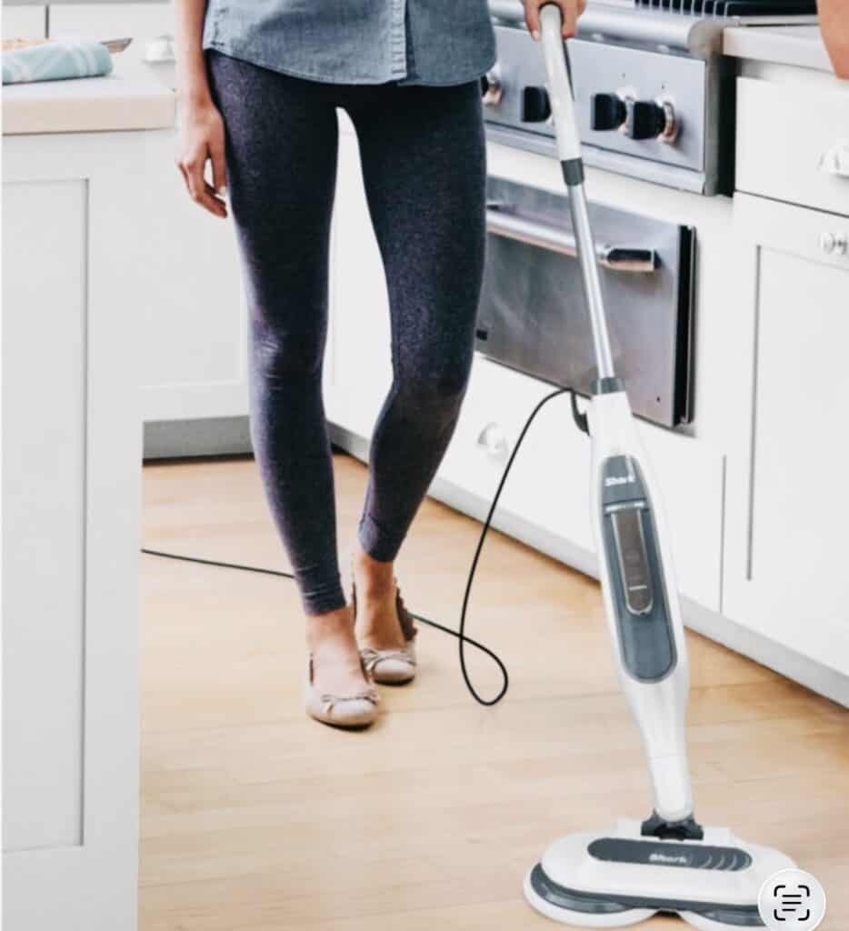 lady cleaning floor with shark steam mop in kitchen. Click on picture link to purchase online.