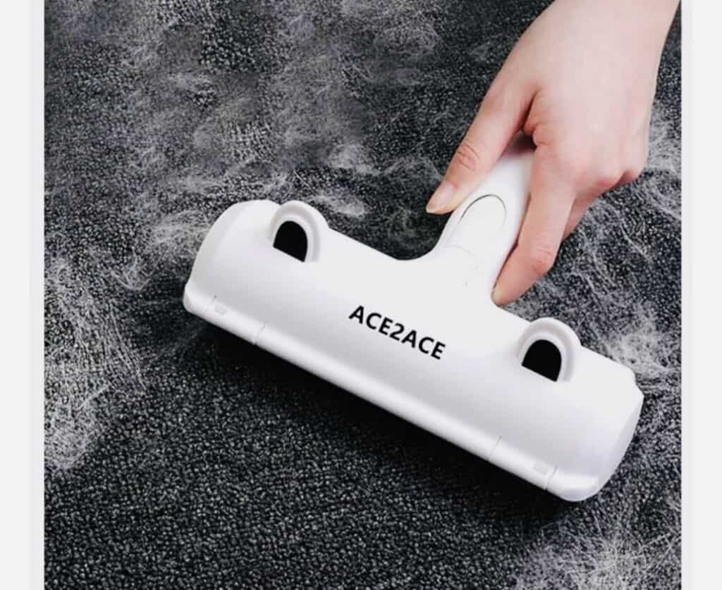 ACE2ACE white pet hair remover machine on couch and carpet. Click on picture link to purchase online.