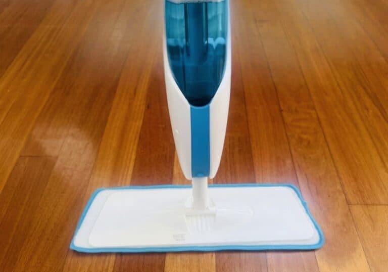 blue and white spray mop on wooden floor